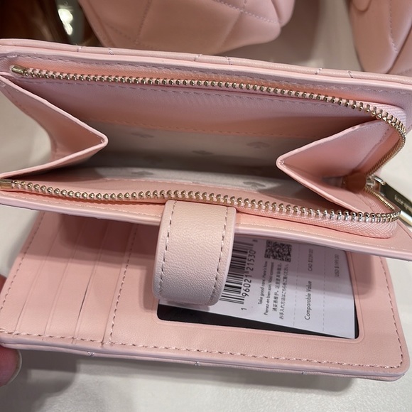 Kate Spade Carey Medium Compartment Bifold Wallet
COLOR: Conch Pink - Picture 12 of 16